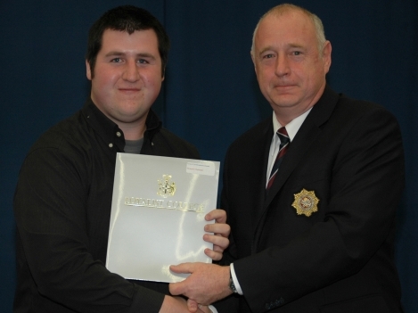Christopher Champagne (left), second-year Community and Justice Services Worker student, was presented the Corps of Commissionaires Award by Ron Tilbrook, representing the Corps of Commissionaires.