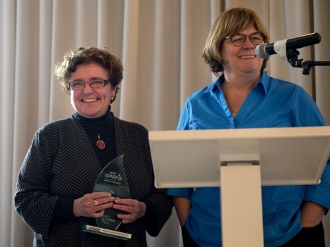 Professor Cathy Goddard, right, presents Jane Harrison, Dean of the School of Media,  Arts and Design, with the Program Support Award. 
