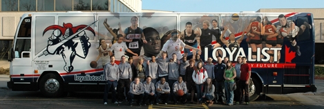 The Loyalist Lancers are hitting the highway in grand style – a bus wrapped from top to bottom that features our College athletes and faithful fans. So when you see them on the road show your support with a loud honk of your horn. Go Lancers!