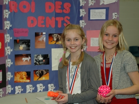 Joelle Proulx (right) and Veronika Latrille are students at L'envol Catholic Elementary School in Trenton. Their 'King of Teeth' project discovered a fun new way to freshen dog breath.
