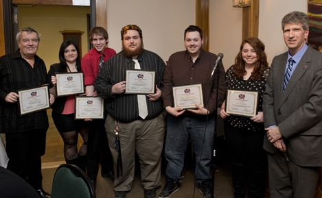 (L to R) 91X board members Steve Bolton, Taylor Lewis, Calvin Bright, Allen Dolphin, Jake McDonald, and Carli Boor pose with Station Manager Greg Schatzmann at the Annual Volunteer Appreciation Dinner and Awards Ceremony.