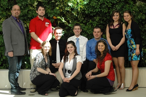 Past and present members of the Loyalist College Student Government are pictured in front of the Living Wall in the newly opened Student Link Lounge. 