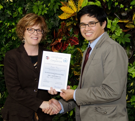 Loyalist College President Maureen Piercy presented a Certificate of Completion to Hower Blair, one of the third-year Environmental students who participated in the Model UN.